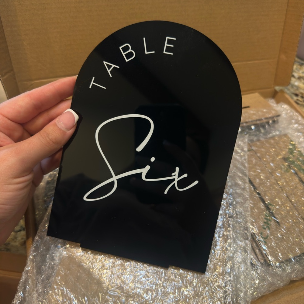 Black Table Sign with White Lettering